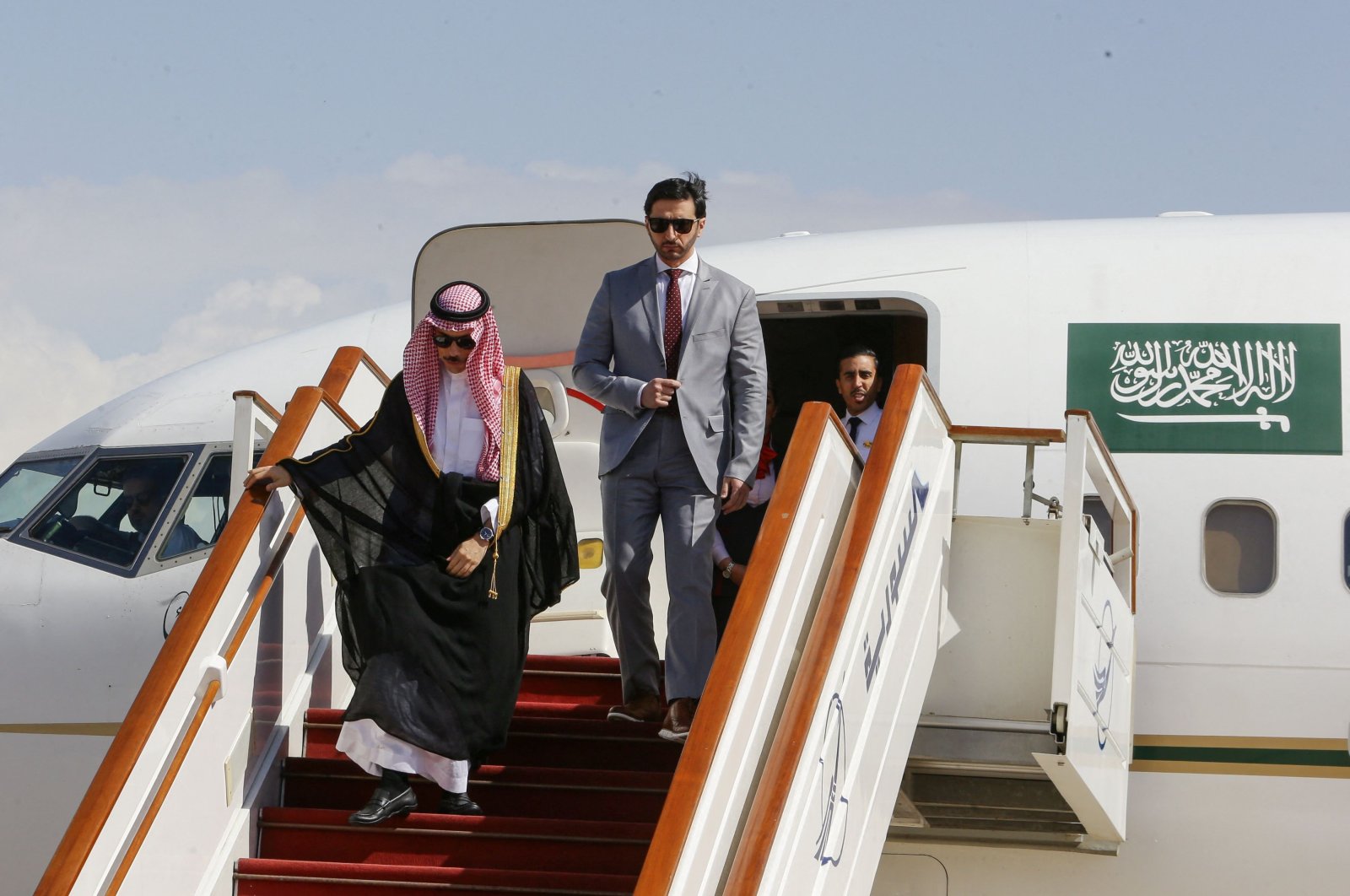 Saudi Foreign Minister Faisal bin Farhan disembarks at Damascus airport, Syria, April 18, 2023. (AFP Photo)