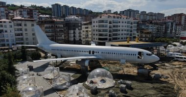 Glass bells are seen on the right side of the plane being turned into a pide lounge in Trabzon, Türkiye, April 18, 2023. (IHA Photo)