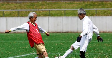 Red Star’s midfielder Mutsuhiko Nomura (L), shoots to score a goal against Blue Hawai’s goalkeeper Hiroshi Nishino, at the SFL (Soccer For Life) 80 League opening match, Tokyo, Japan, April 12, 2023. (Reuters Photo)