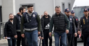 Cryptocurrency exchange Thodex's founder Faruk Fatih Özer, who was extradited to Türkiye by Albania, is escorted by police in Istanbul, Türkiye, April 20, 2023. (AA Photo)