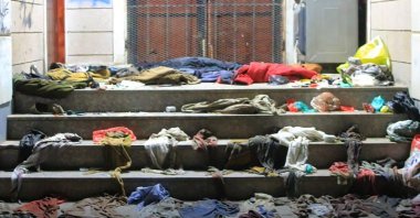Clothes strewn at the scene of a stampede on the steps of a charity distribution center in Sanaa, Yemen, April 20, 2023. (AFP Photo)