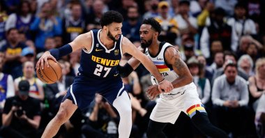 Denver Nuggets guard Jamal Murray (L) controls the ball as Minnesota Timberwolves guard Mike Conley (R) guards in the fourth quarter during game two of the 2023 NBA Playoffs at Ball Arena, Denver, U.S., April 19, 2023. (Reuters Photo)