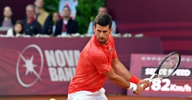 Serbia's Novak Djokovic plays a backhand return to France's Luca van Assche during their tennis singles match at the Sprska Tennis Open ATP 250 series tournament, Banja Luka, Bosnia-Herzegovina, April 19, 2023. (AFP Photo)