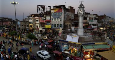 Commuters walk and drive past city&#039;s main circle, in Ayodhya, India, March 28, 2023. (AP Photo)