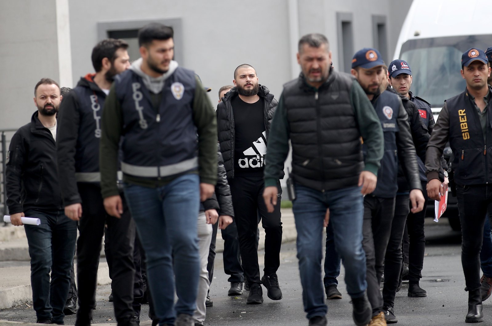 Cryptocurrency exchange Thodex&#039;s founder Faruk Fatih Özer, who was extradited to Türkiye by Albania, is escorted by police in Istanbul, Türkiye, April 20, 2023. (AA Photo)