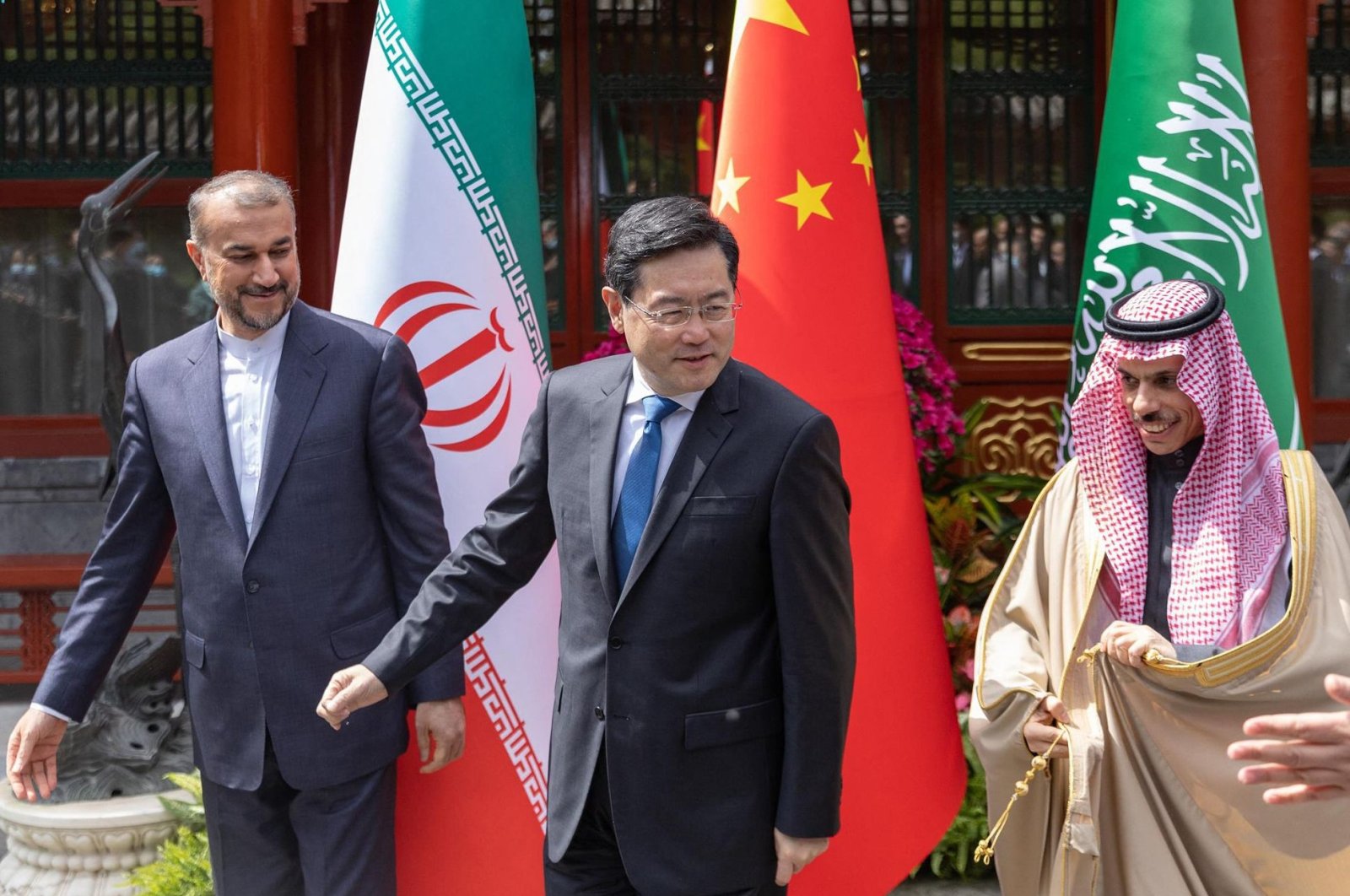 Iranian Foreign Minister Hossein Amir-Abdollahian (L) walking alongside Saudi Foreign Affairs Minister Prince Faisal bin Farhan (R) and Chinese Foreign Minister Qin Gang (C) during a meeting in Beijing, China, April 6, 2023. (AFP Photo)