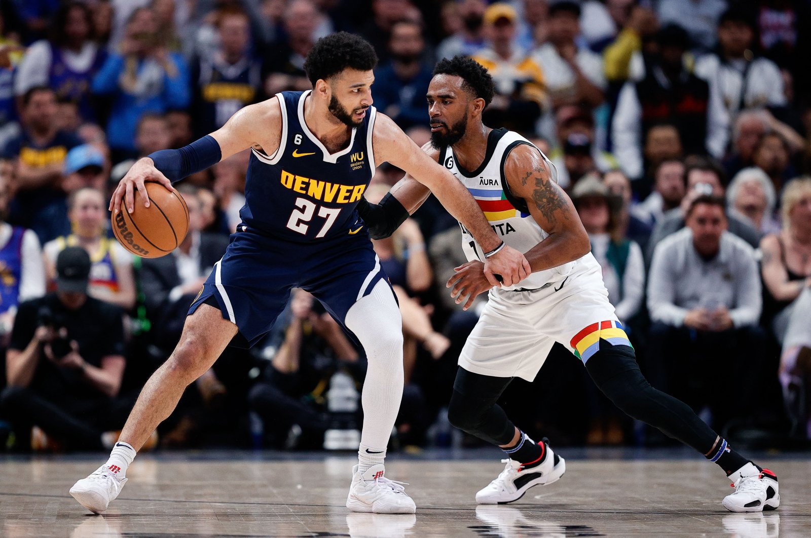 Denver Nuggets guard Jamal Murray (L) controls the ball as Minnesota Timberwolves guard Mike Conley (R) guards in the fourth quarter during game two of the 2023 NBA Playoffs at Ball Arena, Denver, U.S., April 19, 2023. (Reuters Photo)