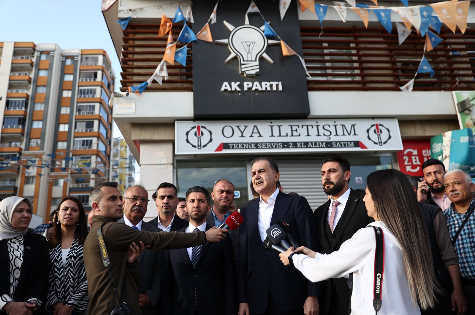 AK Party Spokesman Ömer Çelik speaks to reporters in front of the AK Party Çukurova district headquarters, which was targeted in an armed attack, Thursday, April 20, 2023. (AA Photo)