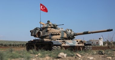 Turkish troops wait in a tank on the outskirts of Afrin, Syria, Oct. 19, 2022. (AFP Photo)