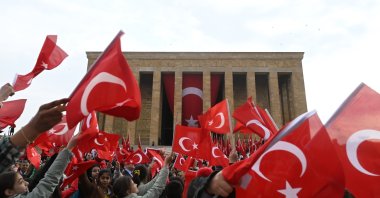 People wave flags in front of Anıtkabir in the capital Ankara, Türkiye, April 23, 2023. (AA Photo)
