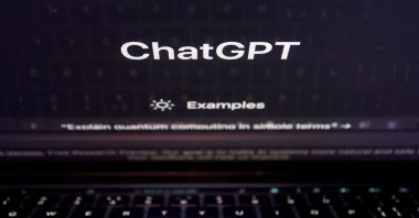 A keyboard is seen reflected on a computer screen displaying the website of ChatGPT, Feb. 8, 2023. (Reuters Photo)