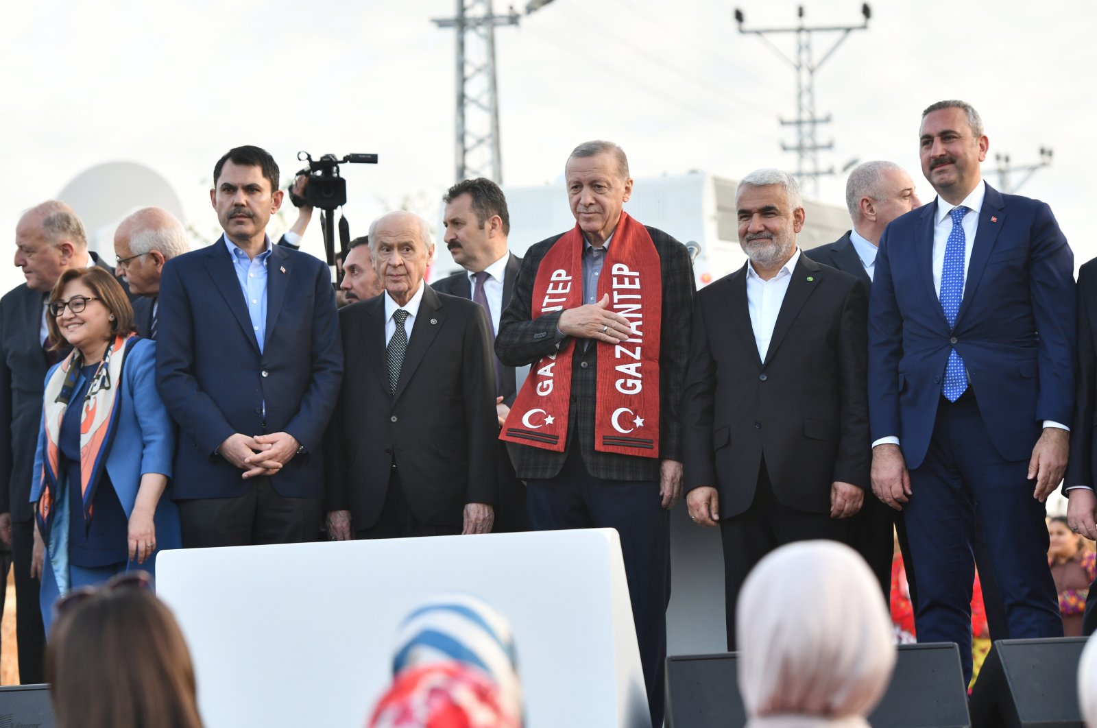 President Recep Tayyip Erdoğan (C) and other Justice and Development Party (AK Party) officials attend a ribbon-cutting ceremony for the delivery of village homes to earthquake victims in the Nurdağı district of southeastern Gaziantep province, Türkiye, April 22, 2023. (AA Photo)