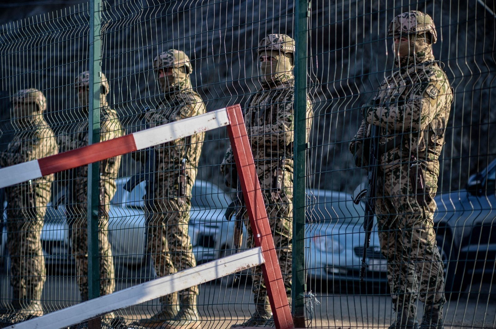 Azerbaijani soldiers stand guard at a checkpoint at the Lachin corridor as Azerbaijani environmental activists protest against illegal mining, Karabakh, Azerbaijan, Dec. 27, 2022. (AFP Photo)
