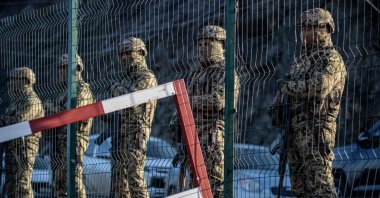 Azerbaijani soldiers stand guard at a checkpoint at the Lachin corridor as Azerbaijani environmental activists protest against illegal mining, Karabakh, Azerbaijan, Dec. 27, 2022. (AFP Photo)