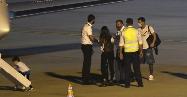 Lionel Messi and Antonella Roccuzzo waiting to board a plane to Barcelona with their family at Islas Malvinas International Airport, Rosario, Argentina, Dec. 28, 2020. (Getty Images File Photo)