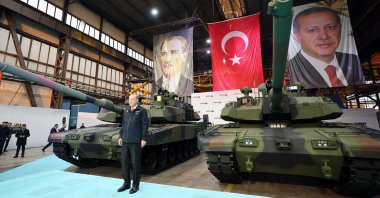 President Recep Tayyip Erdoğan stands beside the domestically built main battle Altay tanks during a ceremony to deliver the vehicles to the Turkish Armed Forces in Sakarya province, northwestern Türkiye, April 23, 2023. (AA Photo)
