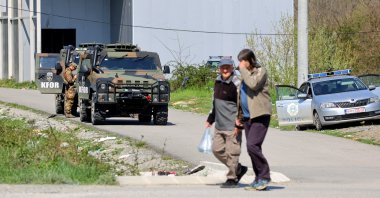 Soldiers of the NATO-led international peacekeeping Kosovo Force (KFOR) stand guard during municipal elections in Northern Mitrovica, Kosovo, 23 April 2023. (EPA Photo)
