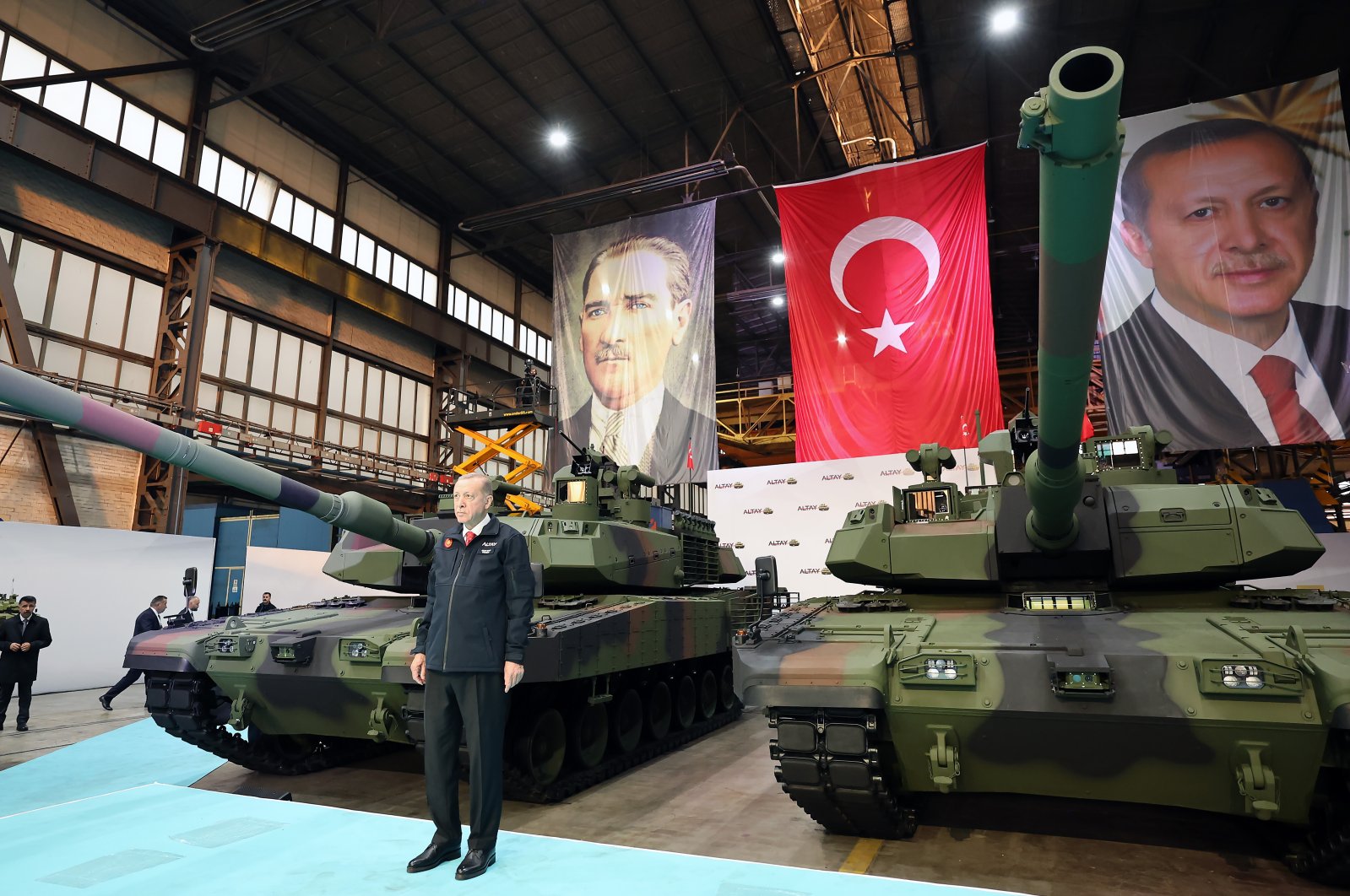 President Recep Tayyip Erdoğan stands beside the domestically built main battle Altay tanks during a ceremony to deliver the vehicles to the Turkish Armed Forces in Sakarya province, northwestern Türkiye, April 23, 2023. (AA Photo)