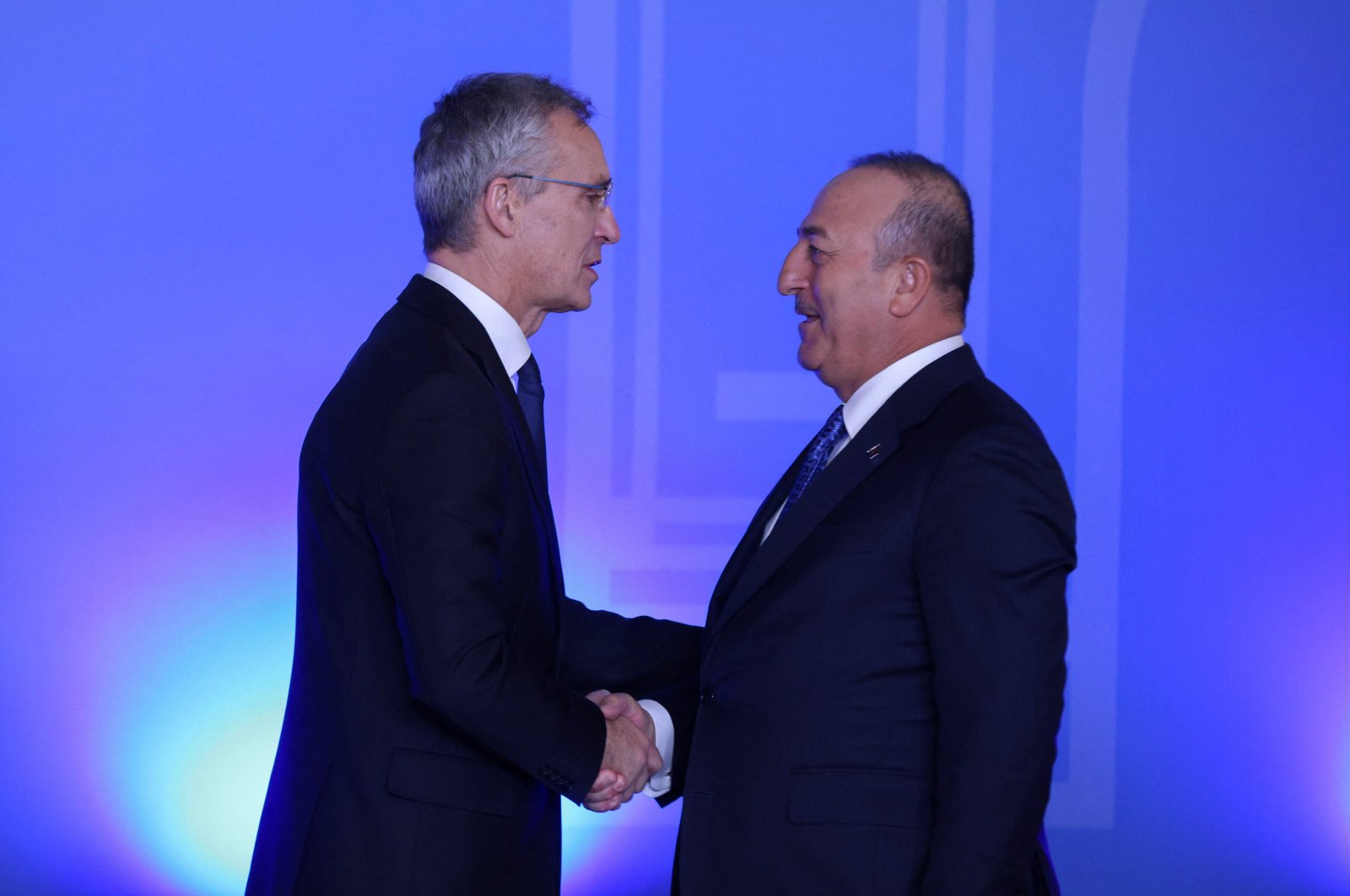 NATO Secretary-General Jens Stoltenberg (L) shakes hands with Foreign Minister Mevlüt Çavuşoğlu (R) at the NATO foreign ministers meeting in Bucharest, Romania, Nov. 29, 2022. (Reuters Photo)