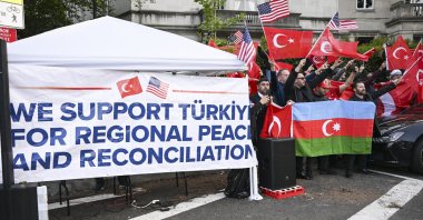 Turks and Azerbaijanis wave Turkish, Azerbaijani and American flags and banners as they counter-protest a group of Armenians that condemned the 1915 events in Ottoman Türkiye, in front of the Turkish Embassy in Washington, U.S., April 24, 2023. (AA Photo)