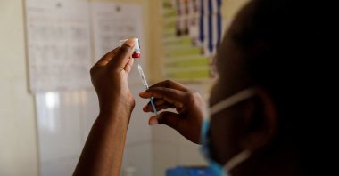 A nurse fills a syringe with a malaria vaccine before administering it to an infant at the Lumumba Sub-County hospital in Kisumu, Kenya, July 1, 2022. (Reuters Photo)