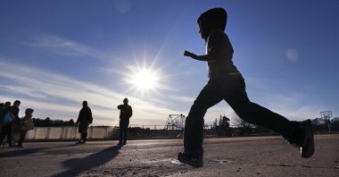 Ahmad Alkhalaf heads out to play soccer with friends during a day camp for local Muslim children in Sharon, Massachusetts, U.S., Dec. 10, 2016. (AP File Photo)