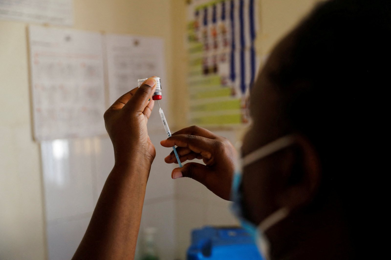 A nurse fills a syringe with a malaria vaccine before administering it to an infant at the Lumumba Sub-County hospital in Kisumu, Kenya, July 1, 2022. (Reuters Photo)