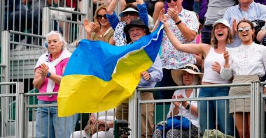Fans wave a Ukraine flag in the stands during day three of the 2022 Wimbledon Championships at the All England Lawn Tennis and Croquet Club, London, UK., June 29, 2022. (Getty Images Photo)