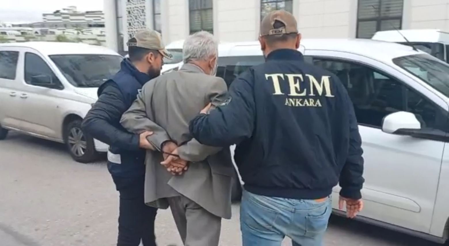 Police officers escort a foreign national after his arrest for suspected links to the Daesh terrorist group in the capital Ankara, Türkiye, April 26, 2023. (DHA Photo)