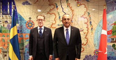 Foreign Minister Mevlüt Çavuşoğlu (R) and his Swedish counterpart Tobias Billström pose for a picture following talks on the sidelines of a NATO foreign ministers' meeting in Brussels, Belgium, April 4, 2023. (AA Photo)