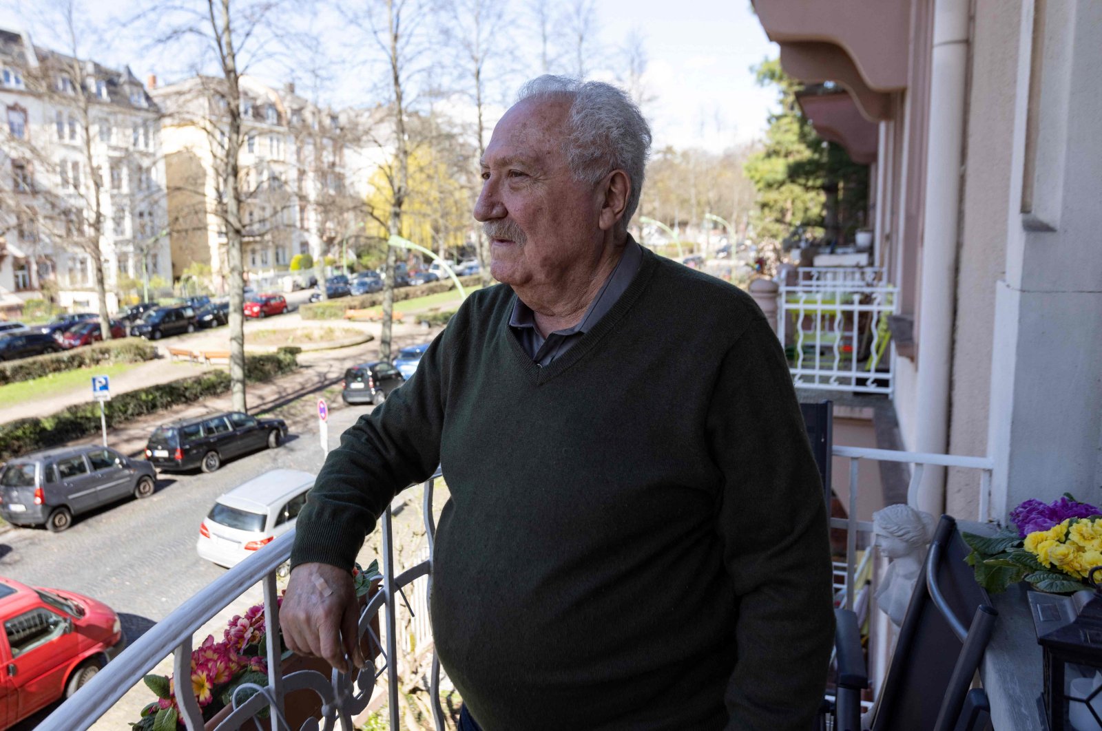 Sener Sargut stands on the balcony of his home in Frankfurt, western Germany, March 27, 2023. (AFP Photo)