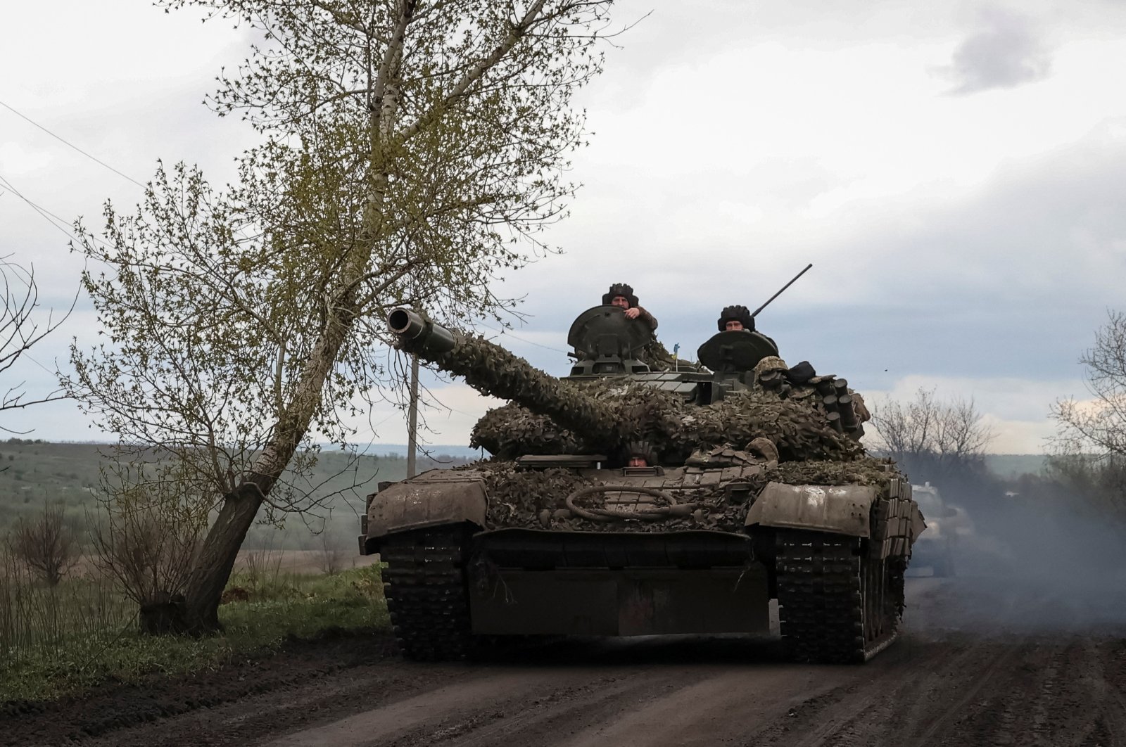 Ukrainian servicemen ride in a tank along a road in the town of Chasiv Yar, Donetsk region, Ukraine, April 22, 2023. (Reuters Photo)
