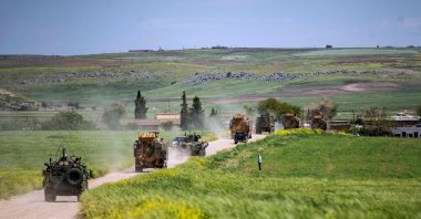 Turkish and Russian military vehicles patrol in the countryside of Rumailan in Hasakeh province bordering Türkiye, northwestern Syria, April 27, 2023. (AFP Photo)
