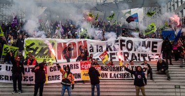 Railway workers display a banner reading "No to the Pension Reform" after occupying the French stock exchange Euronext group headquarters during a protest against the government pension reform in the business district of La Defense in Paris, France, April 20, 2023. (EPA Photo)