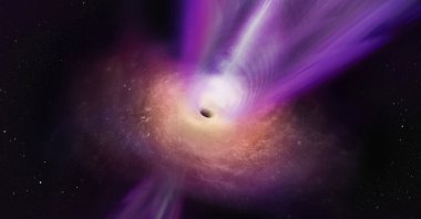 An artist&#039;s conception shows a black hole’s massive jet rising up from the center of the black hole. (Reuters Photo)