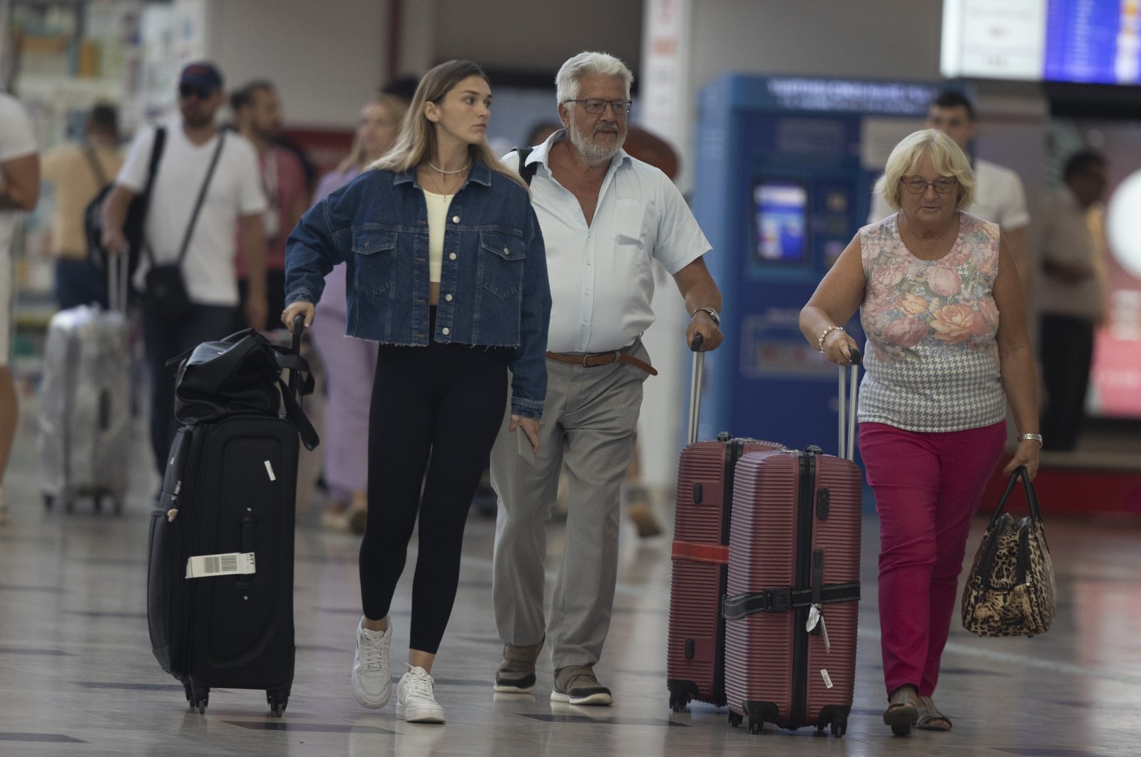 Tourists walk through an airport in the Mediterranean hotspot Antalya, southern Türkiye, Sept. 21, 2022. (AA Photo)