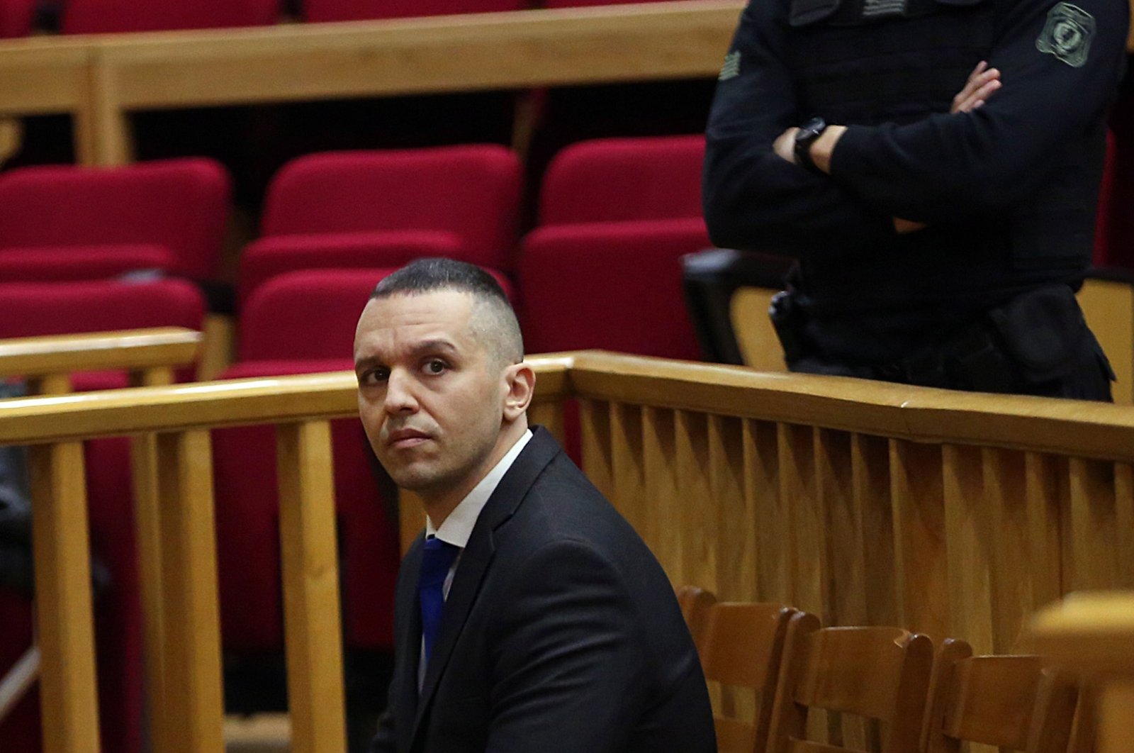 Former Greek deputy Ilias Kasidiaris (L), who was sentenced to 13 years in jail for being a member of and leading the neo-Nazi criminal organization Golden Dawn, at the Athens Appeals Court, Greece, Dec. 14, 2022. (EPA Photo)