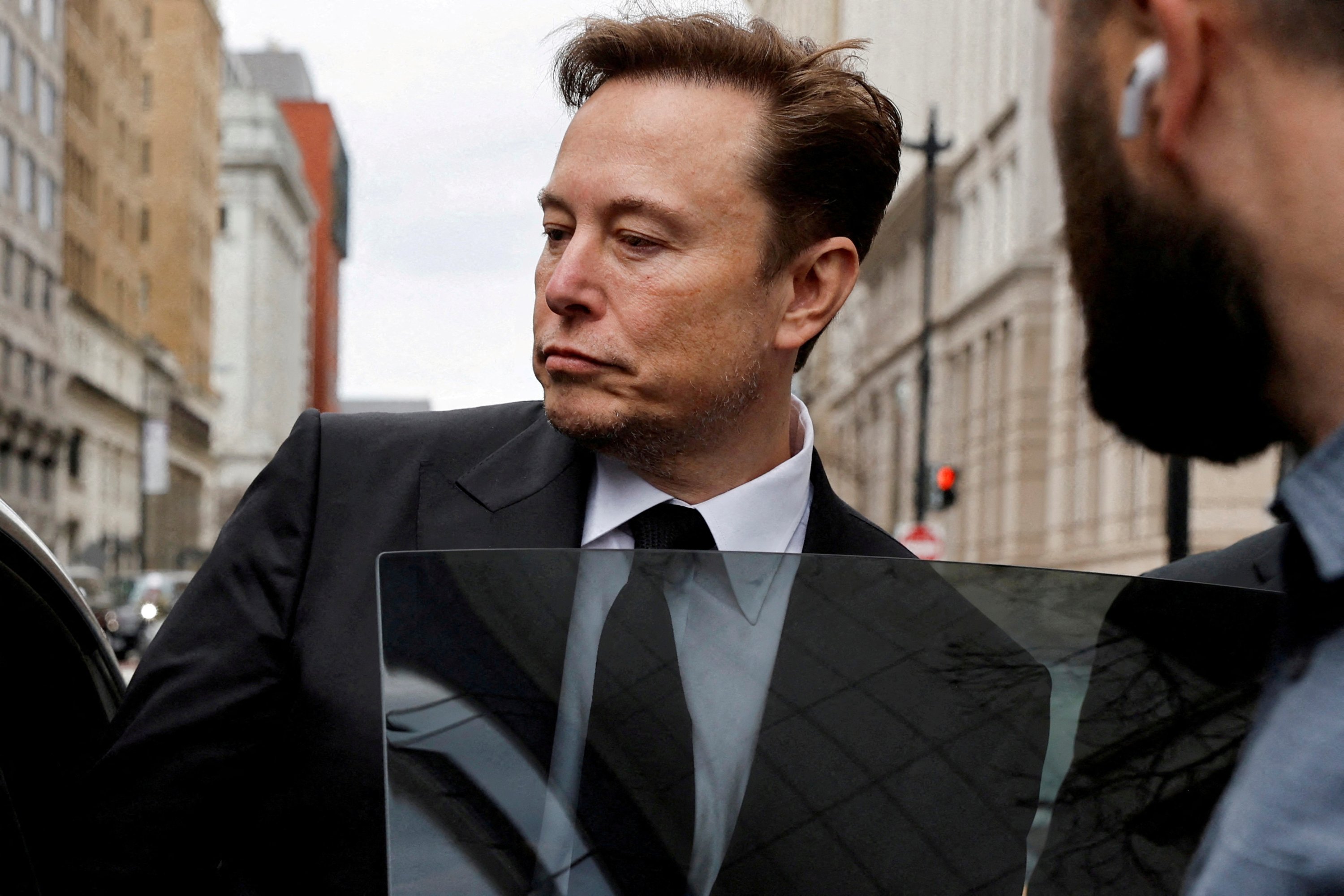 Tesla CEO Elon Musk and his security detail depart the company’s local office in Washington, U.S. Jan. 27, 2023. (Reuters Photo)