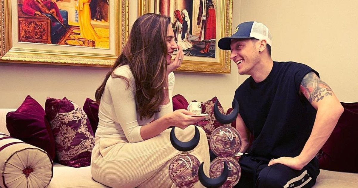 Retired  Turkish-German midfielder Mesut Özil (R) laughs with wife and former Miss Türkiye Amine Gülşe Özil. (Amine Gülşe Özil on Instagram)
