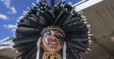 Tommy Sam of Rio Rancho, New Mexico who is Navajo prepares to ride his horse in the horse parade at the 40th anniversary of the Gathering of Nations Pow Wow in Albuquerque, New Mexico, U.S., April 28, 2023. (AP Photo)
