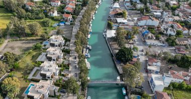 An aerial view of buildings and a river in Hatay's Arsuz district, southern Türkiye, May 1, 2023. (AA Photo)