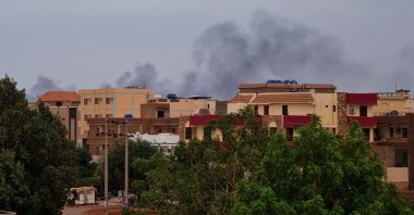 Smoke billows over residential buildings in Khartoum, Sudan, April 30, 2023. (AFP Photo)