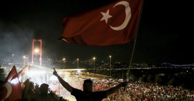 People wave national flags near then-Bosporus Bridge after the July 15 failed coup attempt, in Istanbul, Türkiye, July 22, 2016. (AA Photo)