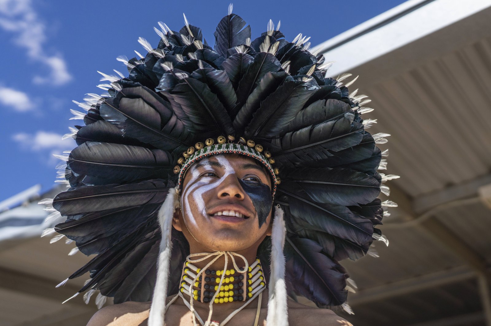 Tommy Sam of Rio Rancho, New Mexico who is Navajo prepares to ride his horse in the horse parade at the 40th anniversary of the Gathering of Nations Pow Wow in Albuquerque, New Mexico, U.S., April 28, 2023. (AP Photo)