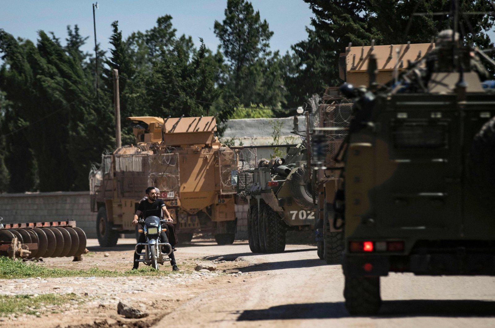 Turkish and Russian military vehicles patrol the countryside in Hasakeh, Syria, Apr. 27, 2023. (AFP Photo) 