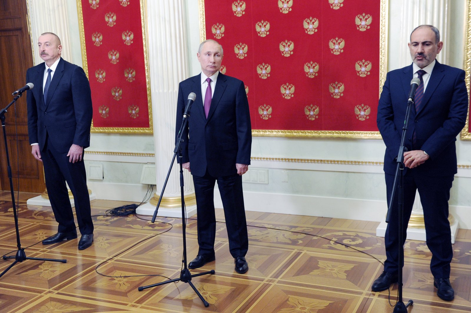 Azerbaijani President Ilham Aliyev (L), Russian President Vladimir Putin (C) and Armenian Prime Minister Nikol Pashinian speak to the media after talks in Moscow, Russia, Jan. 11, 2021. (AP Photo)