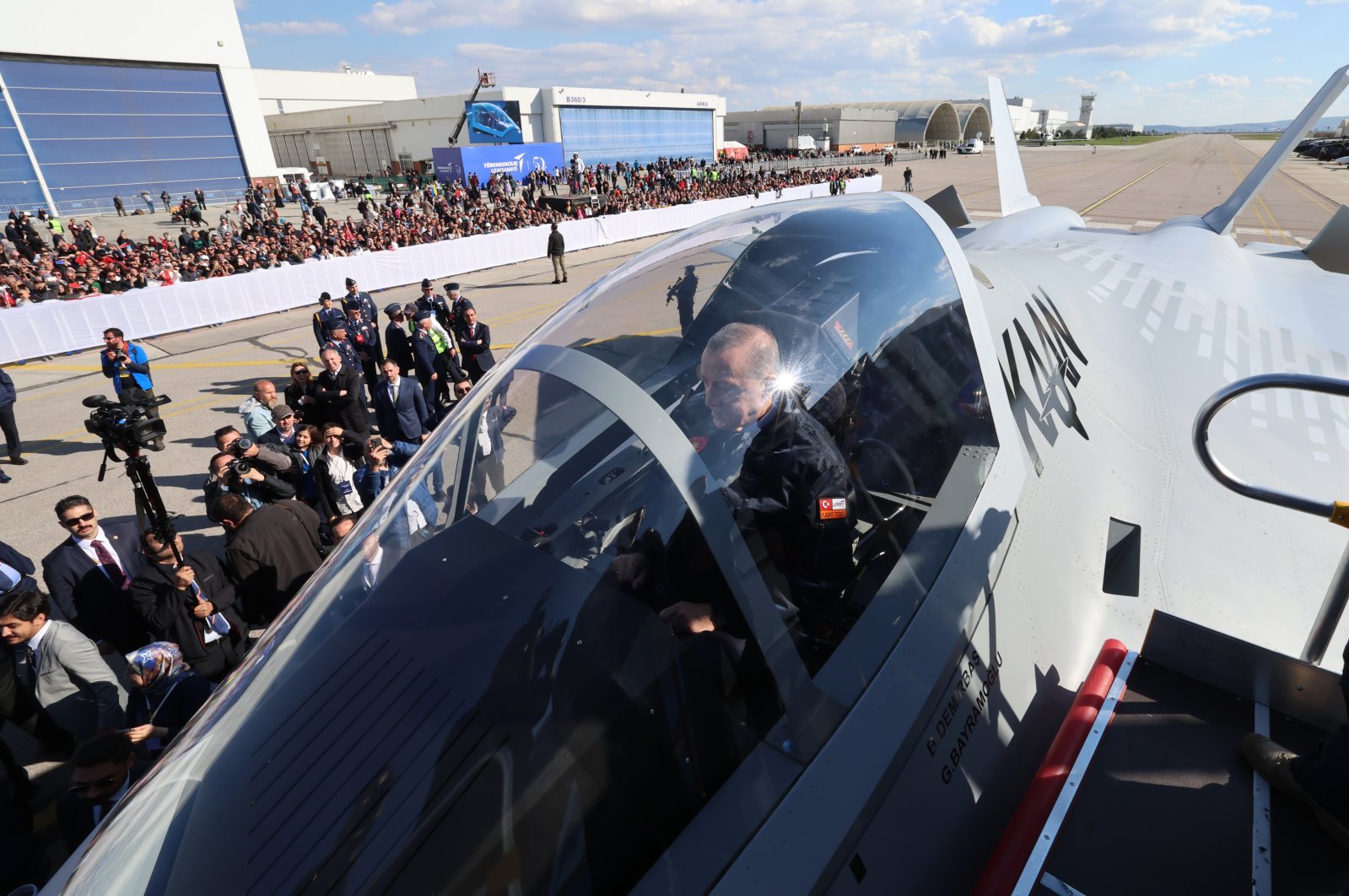 President Recep Tayyip Erdoğan sits inside Türkiye’s domestically developed 5th-generation fighter jet, named &quot;KAAN,&quot; as he attends the &quot;Century of the Future&quot; event at the Turkish Aerospace Industries (TAI) headquarters in the Kahramankazan district of Ankara, Türkiye, May 1, 2023. (AA Photo) 