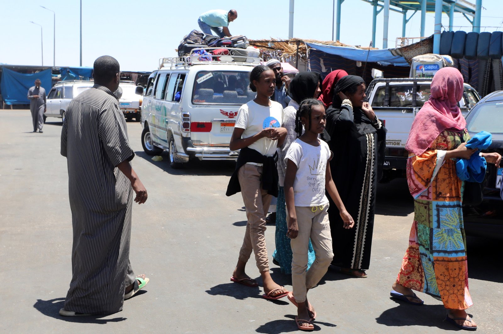 People fleeing from Sudan arrive at Wadi Karkar bus station in Aswan, southern Egypt, May 1, 2023. (EPA Photo)
