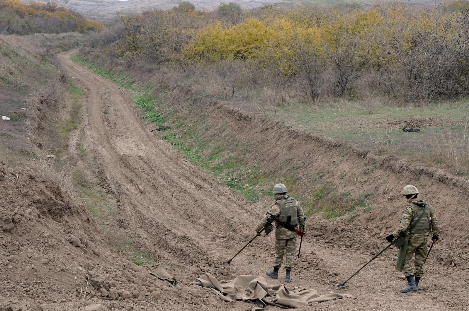 Azerbaijan military sappers clear Armenian mines in the countryside outside the town of Fuzuli, Azerbaijan, Nov. 26, 2020. (AFP Photo)