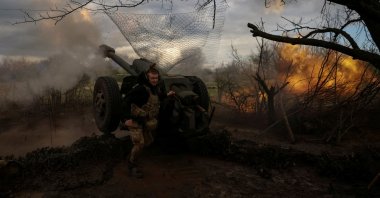 Ukrainian service members fire a howitzer D30 at a front line near the city of Bakhmut, Ukraine, April 23, 2023. (Reuters Photo)